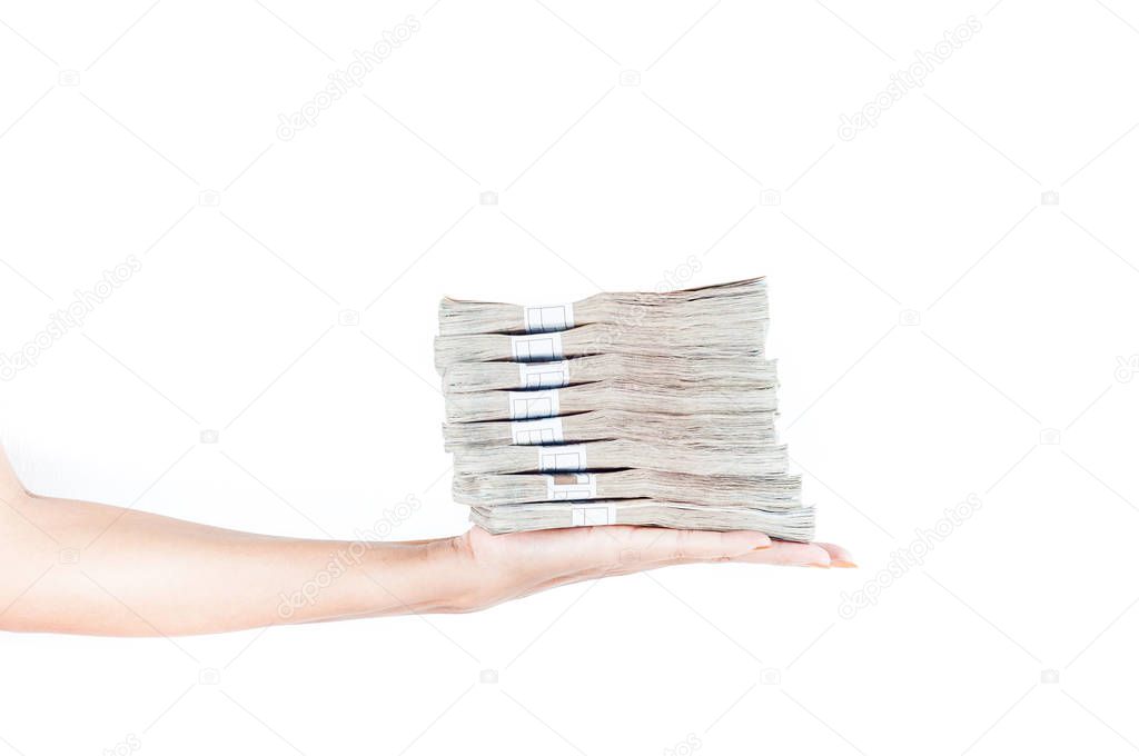 female hand holding money stacks on white background 