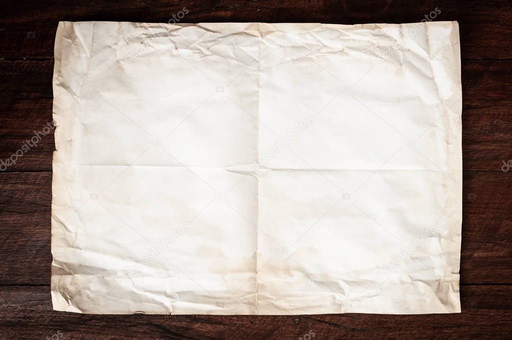 Background texture of crumpled aged paper with spot and stain