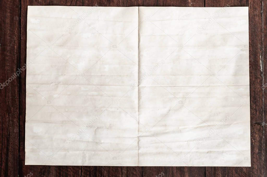 Background texture of crumpled aged paper with spot and stain