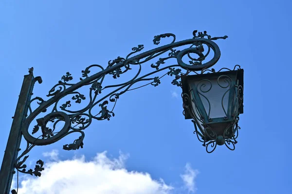 Decorative lamp against the background of the sky. Braniewo, Poland