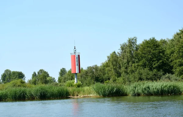 The sea navigation sign on the bank of the Kaliningrad ship canal. Kaliningrad region