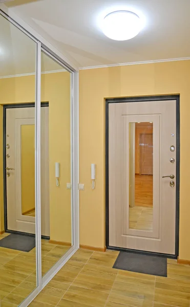 Entrance door in an apartment corridor