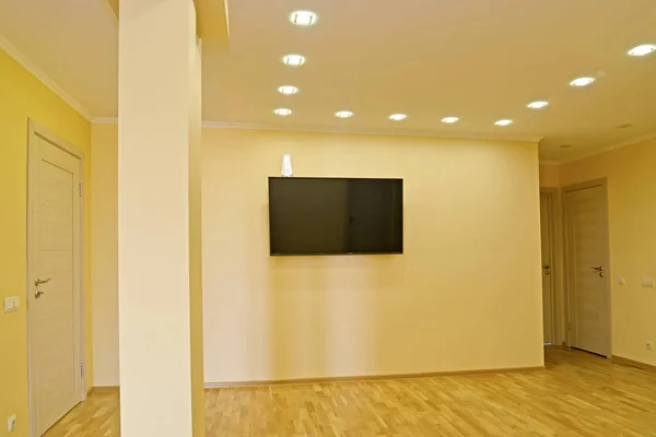 The hall with the TV on a wall — Stock Photo, Image