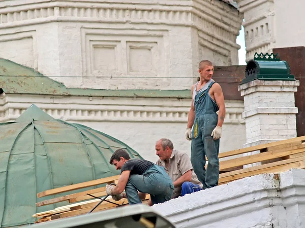 YAROSLAVL, RUSSIA - JUNE 18, 2008: Workers repair a roof of the church building