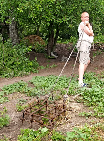 Man Drags Old Harrow Rope Yard Effort Rural Life — Stock Photo, Image