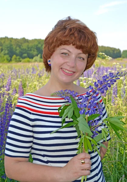 Happy Middle Aged Woman Holding Bouquet Blooming Lupins Her Hand — Stock Photo, Image