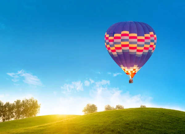 summer landscape with hot air balloon