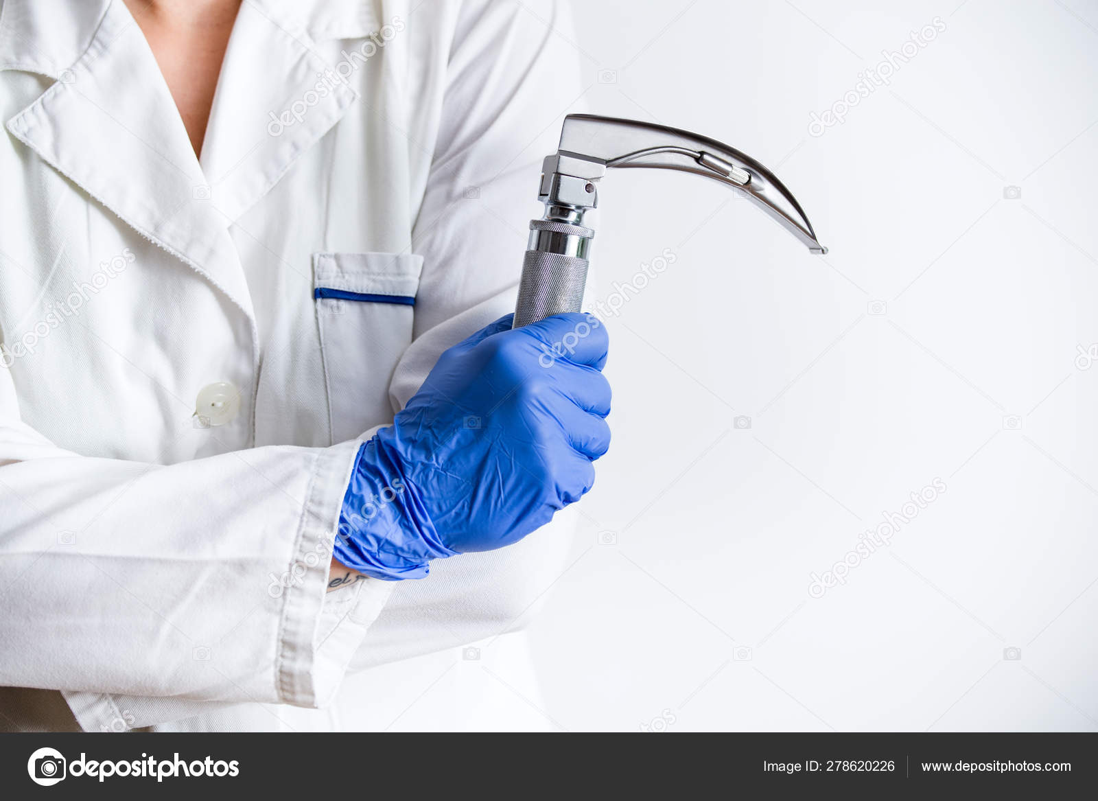 Hand's doctor holding laryngoscope, isolated on white background, copy