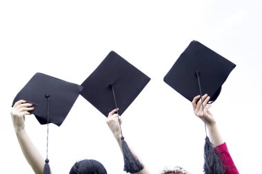 Holding graduation hats background clipart
