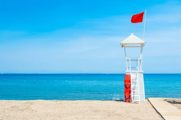 White wooden rescue tower for lifeguards on the beach of the Mediterranean Sea, Antalya, Turkey