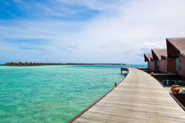 Wooden villas over water of the Indian Ocean, Maldives