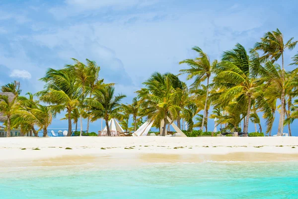 Chill lounge zone with a tent and seating areas in luxury hotel on the shore of Indian Ocean, Maldives