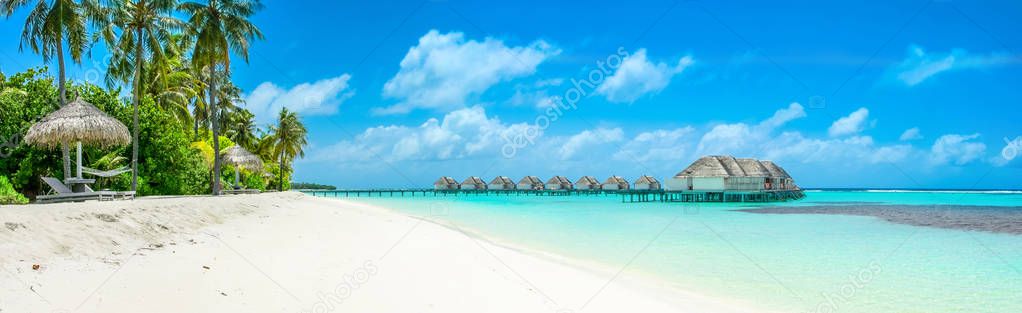 Beautiful panoramic landscape of over water villas, Maldives island, Indian Ocean