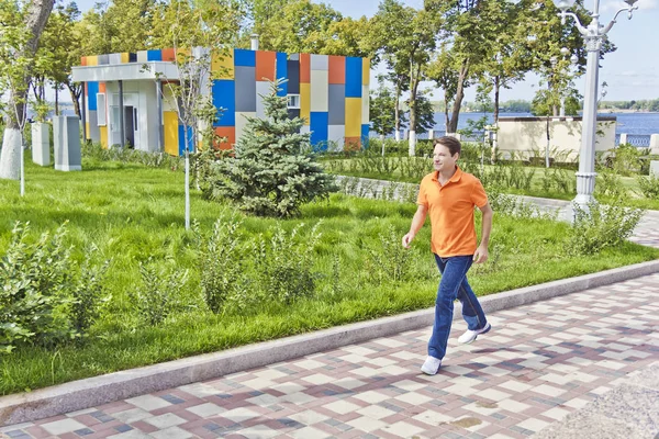 Man Orange Clothes Running Embankment — Stock Photo, Image