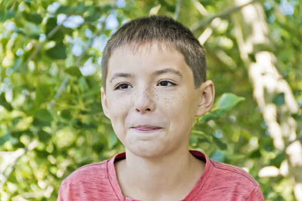 Horizontal portrait teenager boy in pink with tongue out