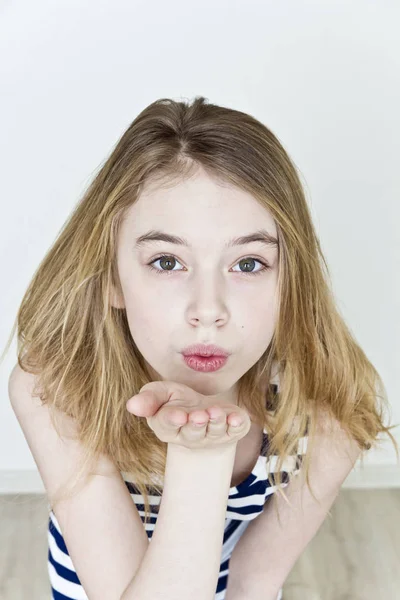 Girl Blond Long Hair Striped Clothes Sending Air Kiss — Stock Photo, Image