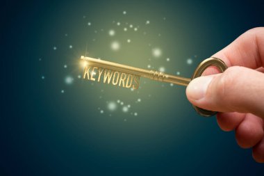 Keywords are a key for successful SEO concept. Unlock potential of your web with optimized keywords. Hand with key with text words. clipart