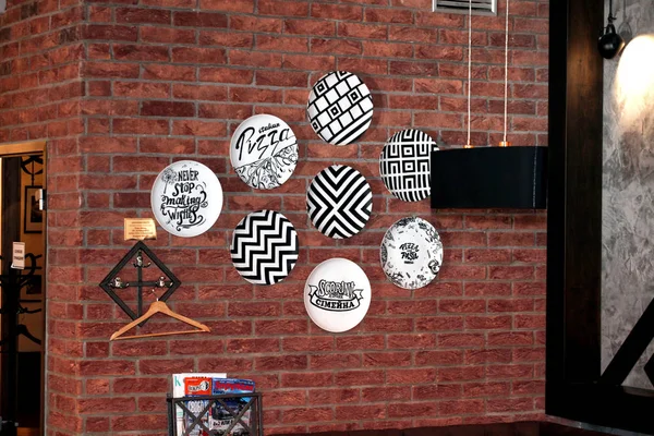 the wall in the restaurant is decorated with plates