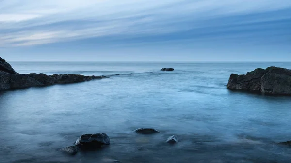 Beautiful Long Exposure Landscape Image Beach Dunstanburgh Northumberland — Stock Photo, Image