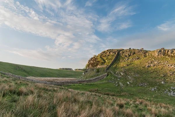 Stunning landscape image of Hadrian\'s Wall in Northumberland at sunset with fantastic late Spring light