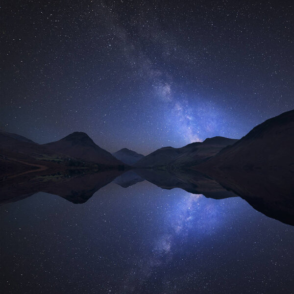 Stunning vibrant Milky Way composite image over landscape of Wast Water and mountains in Lake District