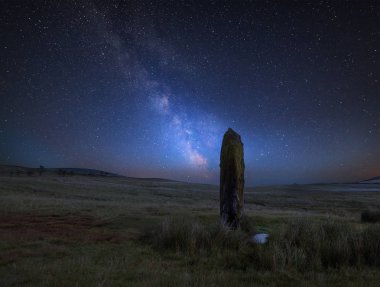 Stunning vibrant Milky Way composite image over landscape of Ancient prehistoric stones in Wales clipart