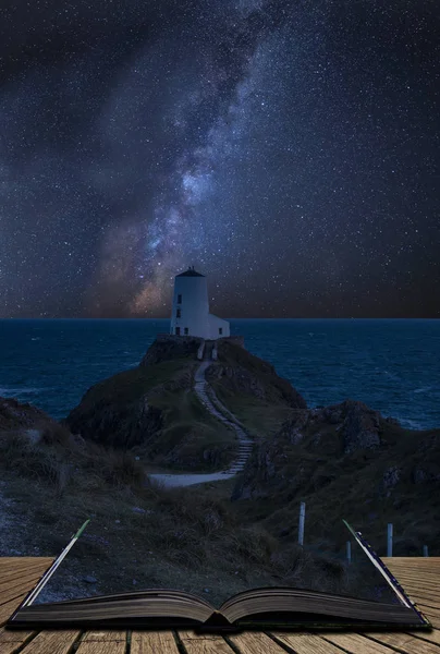 Vibrant Milky Way composite image over landscape of lighthouse o