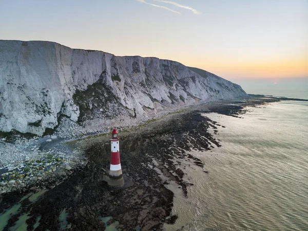 Stunning Aerial drone landscape image of lighthouse and chalk cl