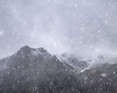 Stunning moody dramatic Winter landscape image of snowcapped Y G clipart