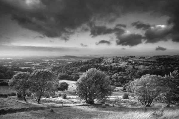 Stunning black and white landscape image of view over English co