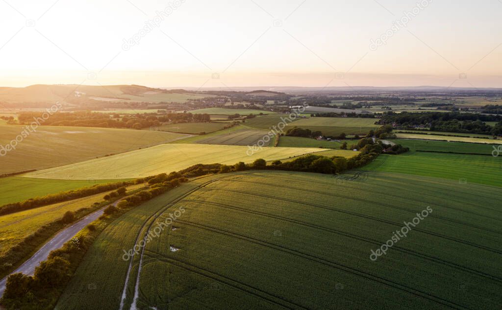 Stunning drone landscape image over lush green Summer English countryside during late afternoon light