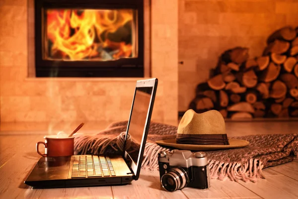 Laptop Notebook Hat Camera Cup Fireplace Background Concept Freelance Remote — Stock Photo, Image