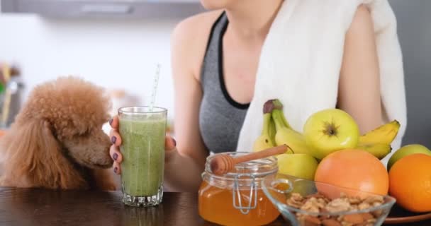 Young Woman Drinking Smoothie Home Kitchen Workout — Stock Video