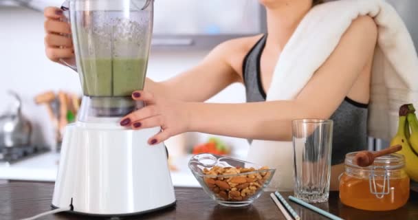 Young Woman Making Green Juice Juice Machine Home Kitchen Workout — Stock Video