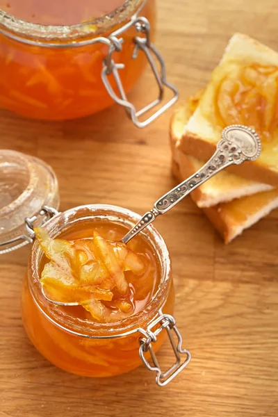 Toasts White Bread Smeared Orange Jam Spoon Glass Jar Wooden — Stock Photo, Image