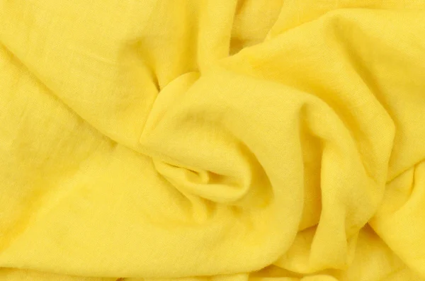 Nahaufnahme zerknüllt gelben Baumwollstoff Hintergrund — Stockfoto