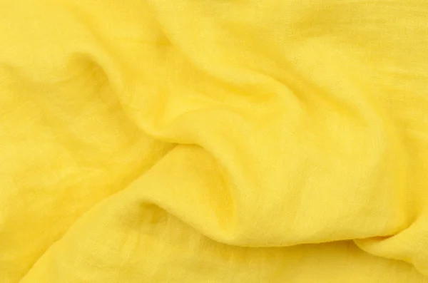 Close up crumpled amarelo tecido de algodão fundo — Fotografia de Stock