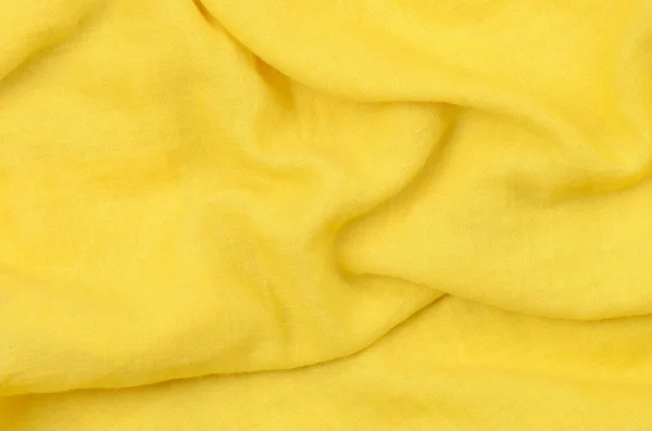 Close up crumpled amarelo tecido de algodão fundo — Fotografia de Stock