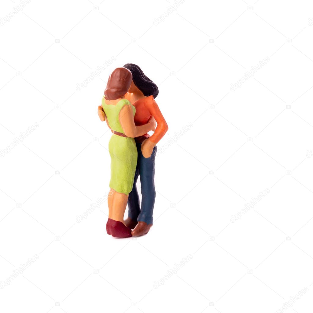 Miniature Lesbian Female Gay Couple, Two tiny puppet Women Kissing Each other, Concept of Homosexual Relationship.