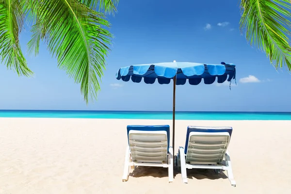 Beach chairs with umbrella — Stock Photo, Image