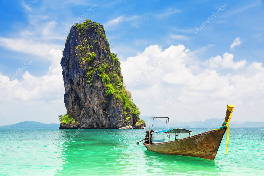 Thai traditional longtail boat and beautiful sand beach