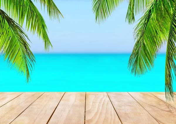 Wooden table top on blue sea and white sand beach — Stock Photo, Image