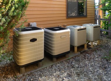 Air conditioning units outside an apartment complex clipart