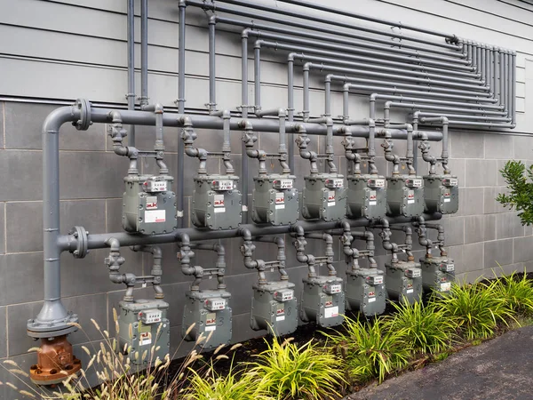 Rows of gas meters measuring gas consumption to apartments
