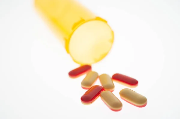 Pills Capsules Medication Pouring Out Orange Plastic Bottle — Stock Photo, Image