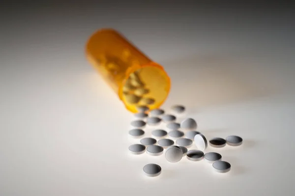 Pills Capsules Medication Pouring Out Orange Plastic Bottle — Stock Photo, Image