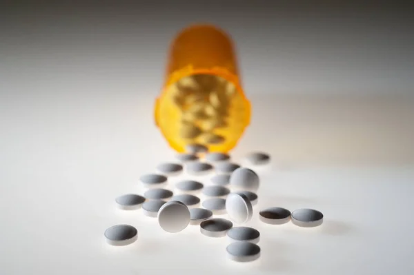 Pills Capsules Medication Pouring Out Orange Plastic Bottle — Stock Photo, Image