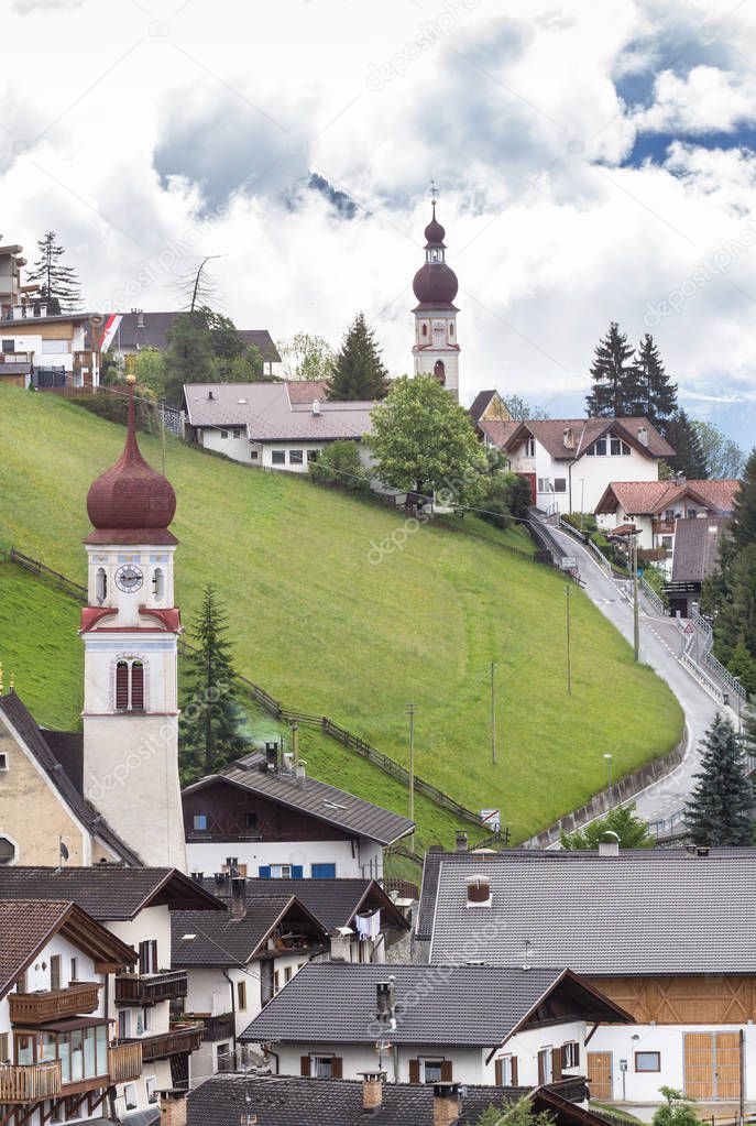 View to the bell towers of the mountain village churches in South Tyrol, northern Italy