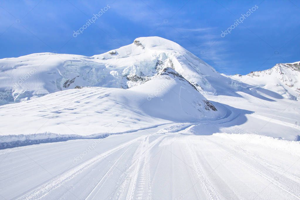 Ski tracks in the snow-capped mountains of Switzerland