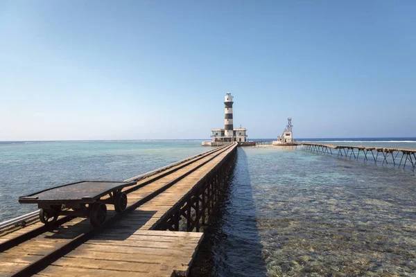 stock image Long wooden piel leading into the sea